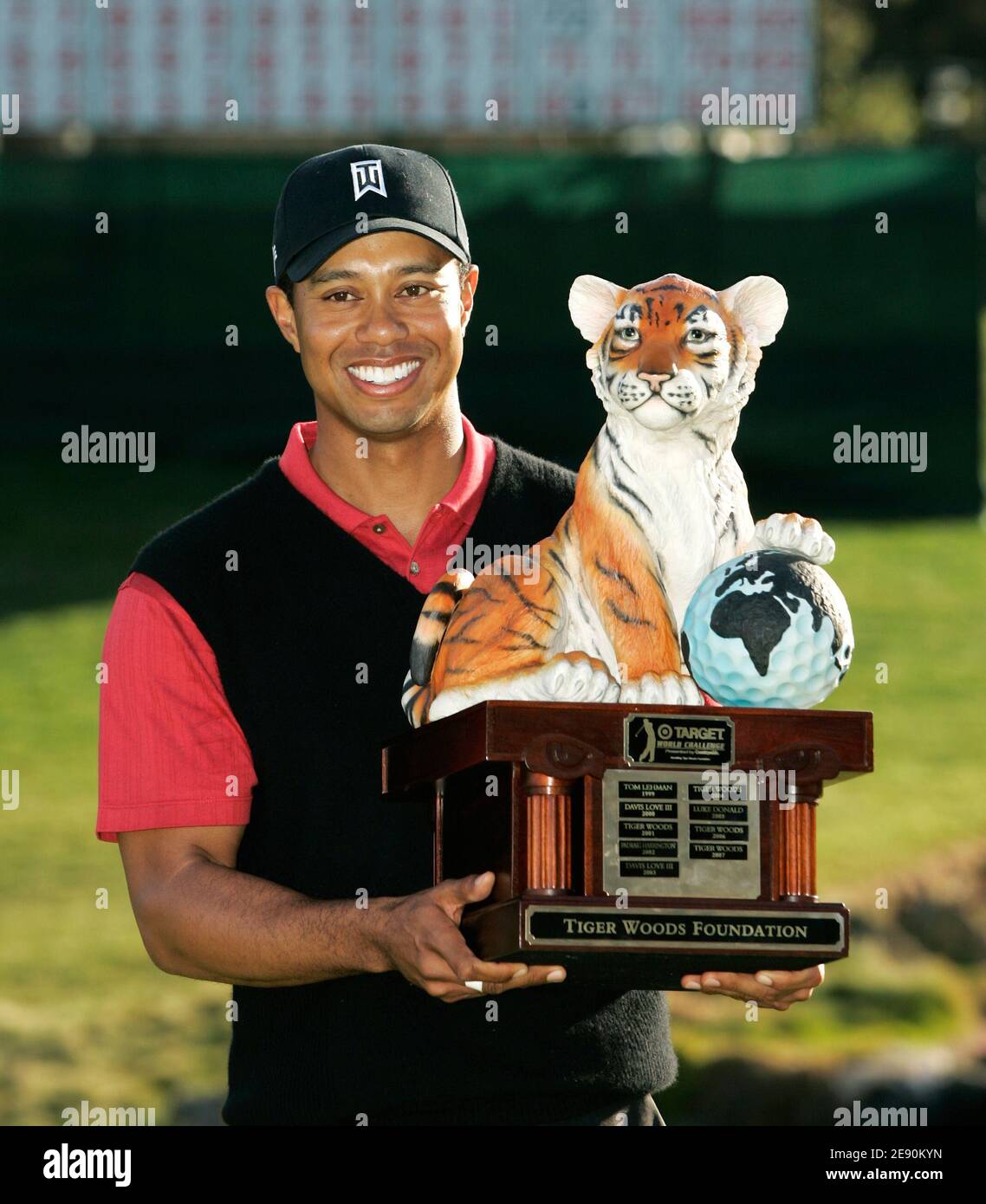 Tiger Woods holds his trophy after winning the Target World Challenge