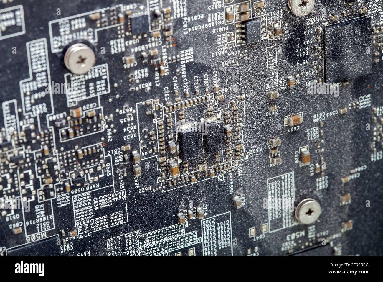 surface of the printed circuit board with dirty chips covered with a