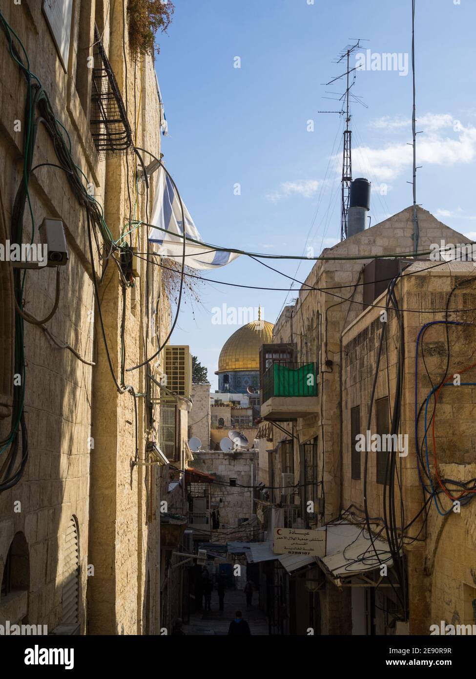 The Dome of the Rock seen at the end of a street from the Muslim Quarter of Old Jerusalem Stock Photo
