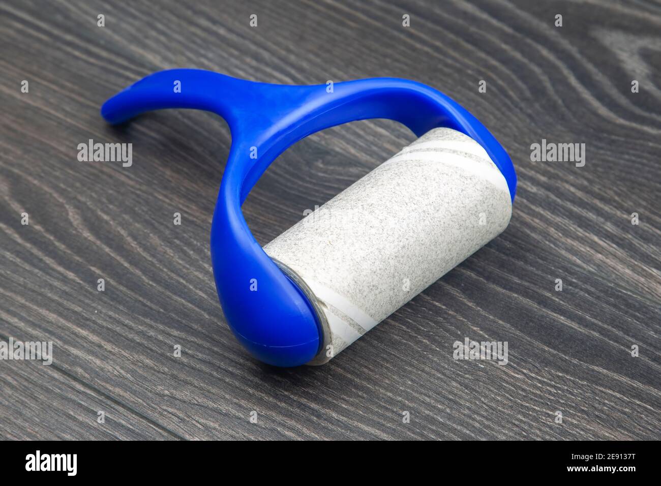 sticky plastic roller for cleaning clothes from dust, lint and hair Stock Photo Alamy