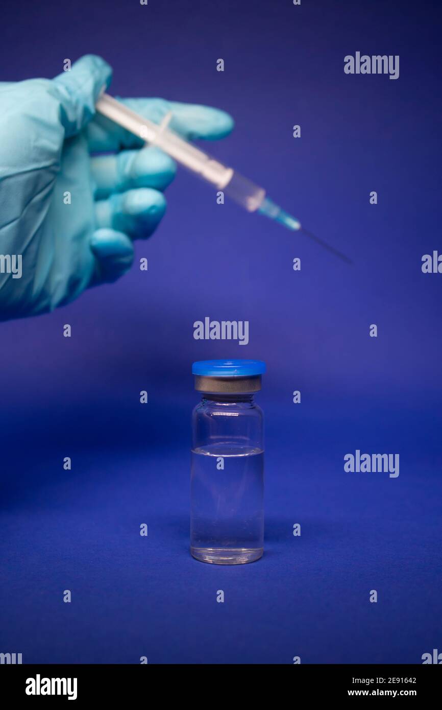 Development of coronavirus vaccine COVID-19. medical syringe with ...