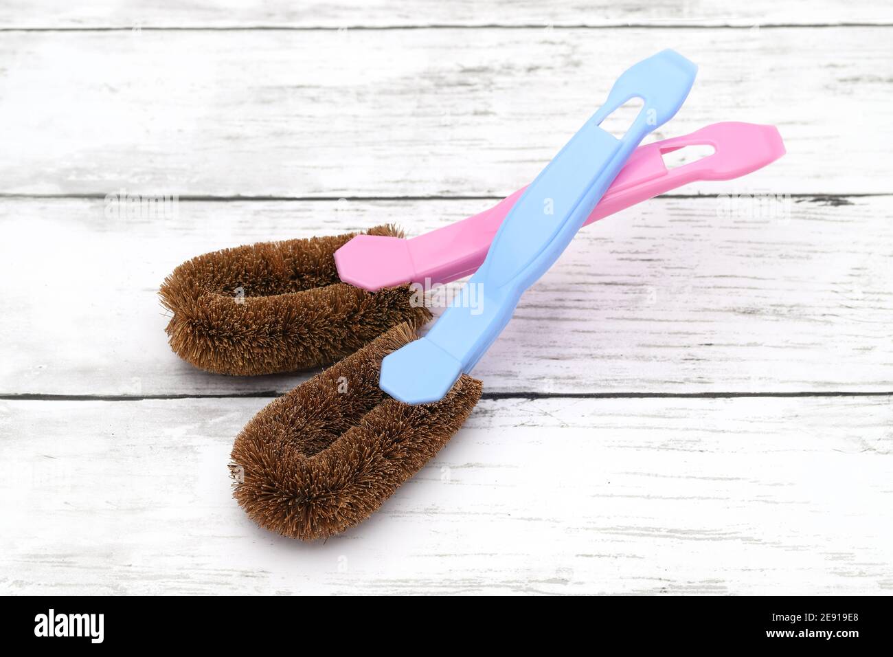scrub brush with handle on dirty white table Stock Photo