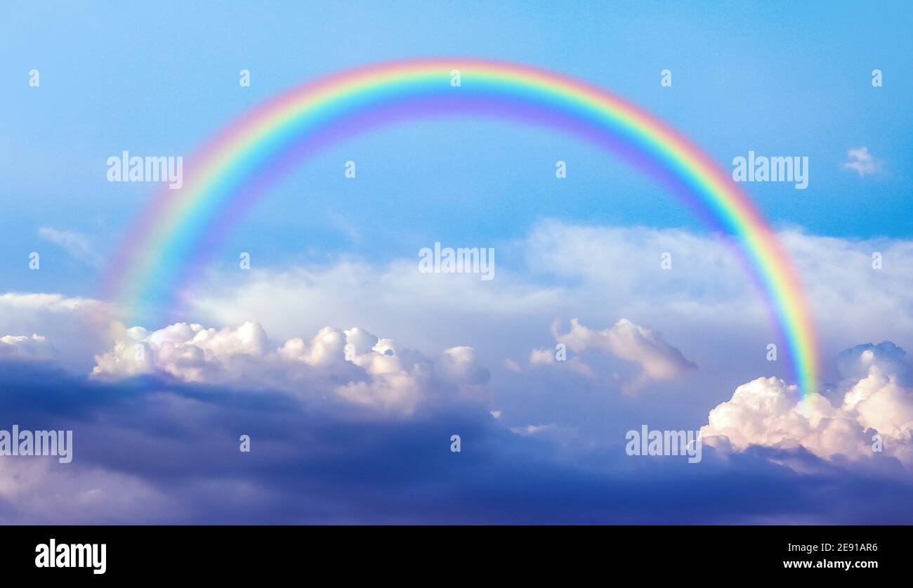 Beautiful view of blue sky with clouds and rainbow Stock Photo - Alamy