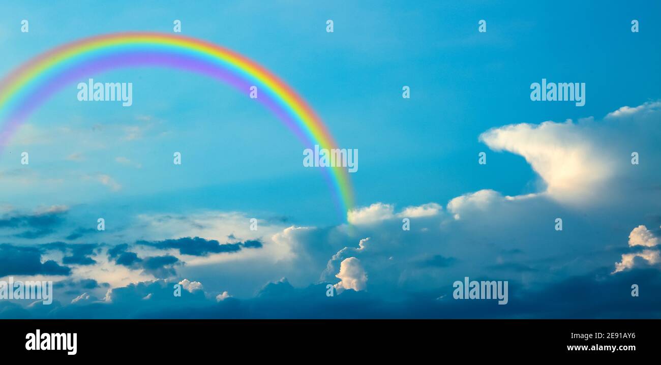 Beautiful view of blue sky with clouds and rainbow Stock Photo - Alamy