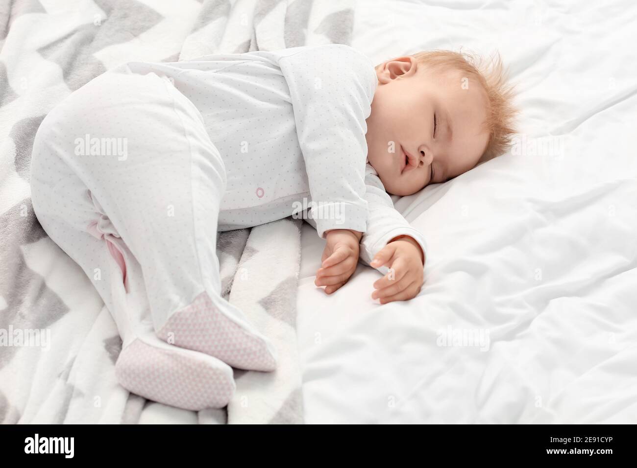 Cute little baby sleeping on bed Stock Photo Alamy