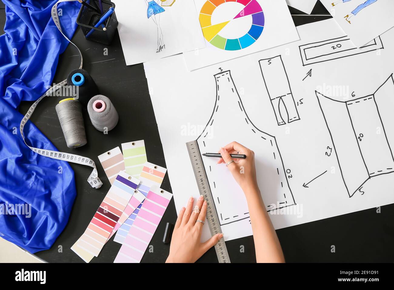 Female fashion designer working in studio, closeup Stock Photo - Alamy