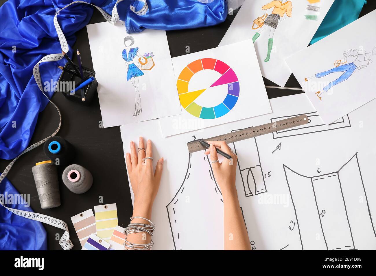 Female fashion designer working in studio, closeup Stock Photo - Alamy