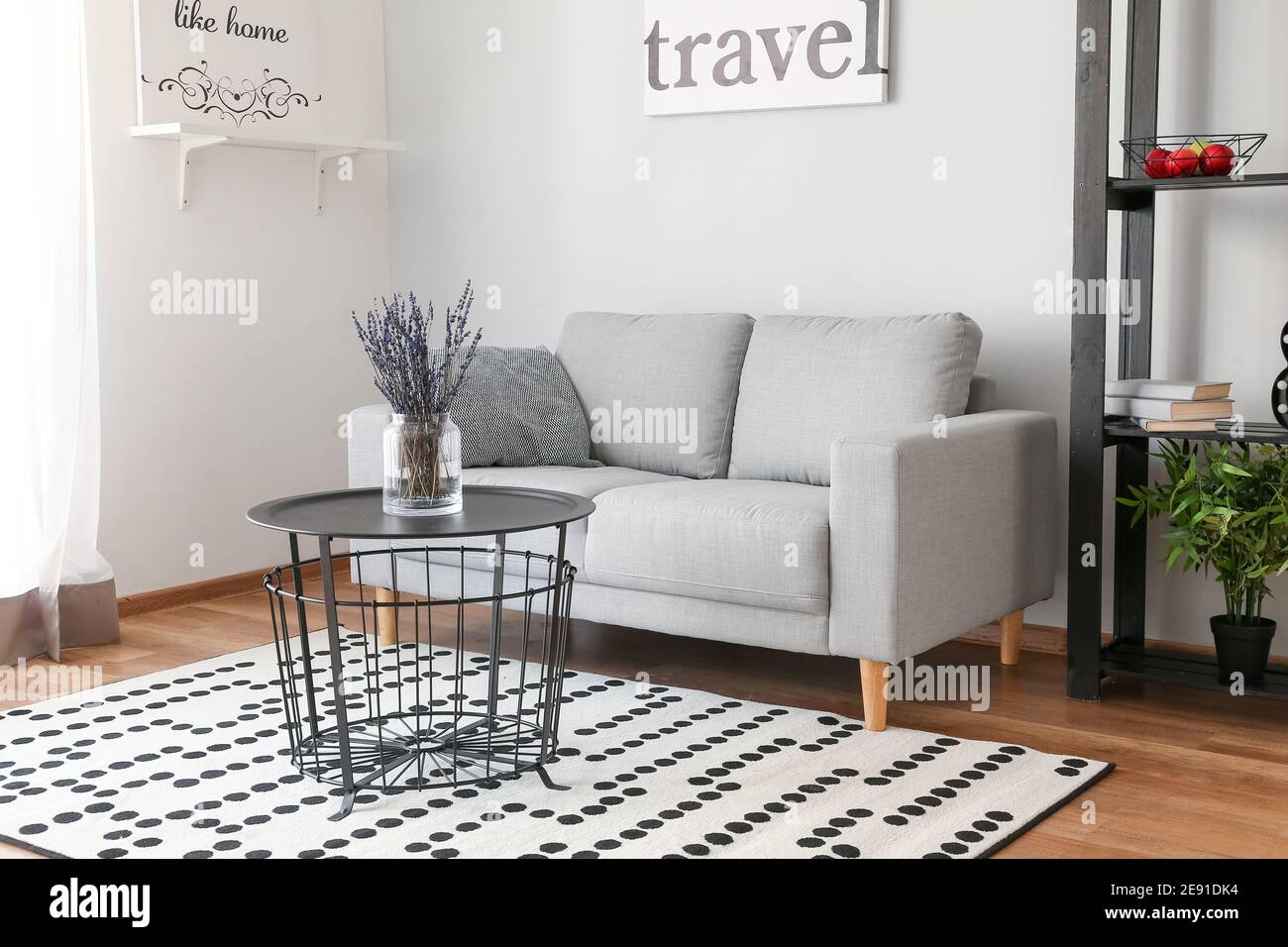 Stylish interior of living room with sofa Stock Photo - Alamy