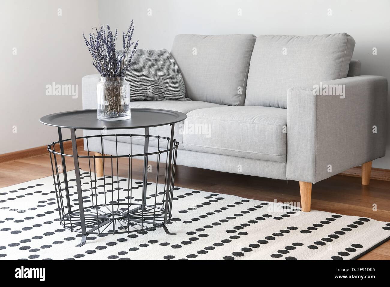 Stylish interior of living room with sofa Stock Photo - Alamy