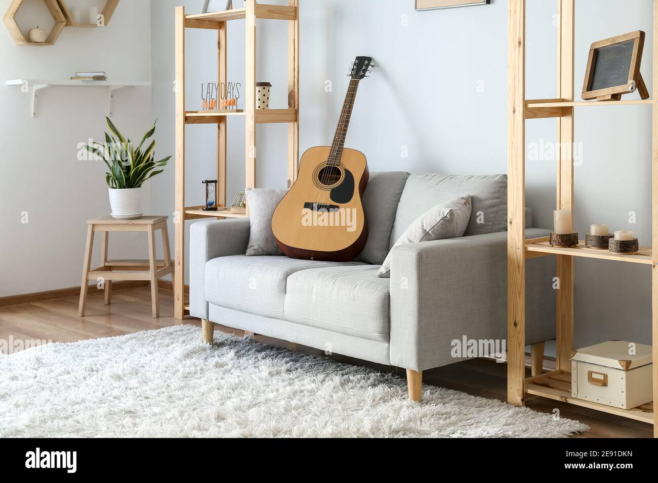 Stylish interior of living room with sofa Stock Photo - Alamy