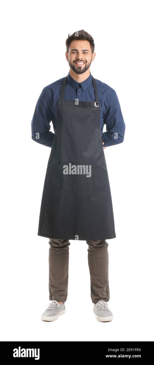 Young man wearing apron on white background Stock Photo - Alamy