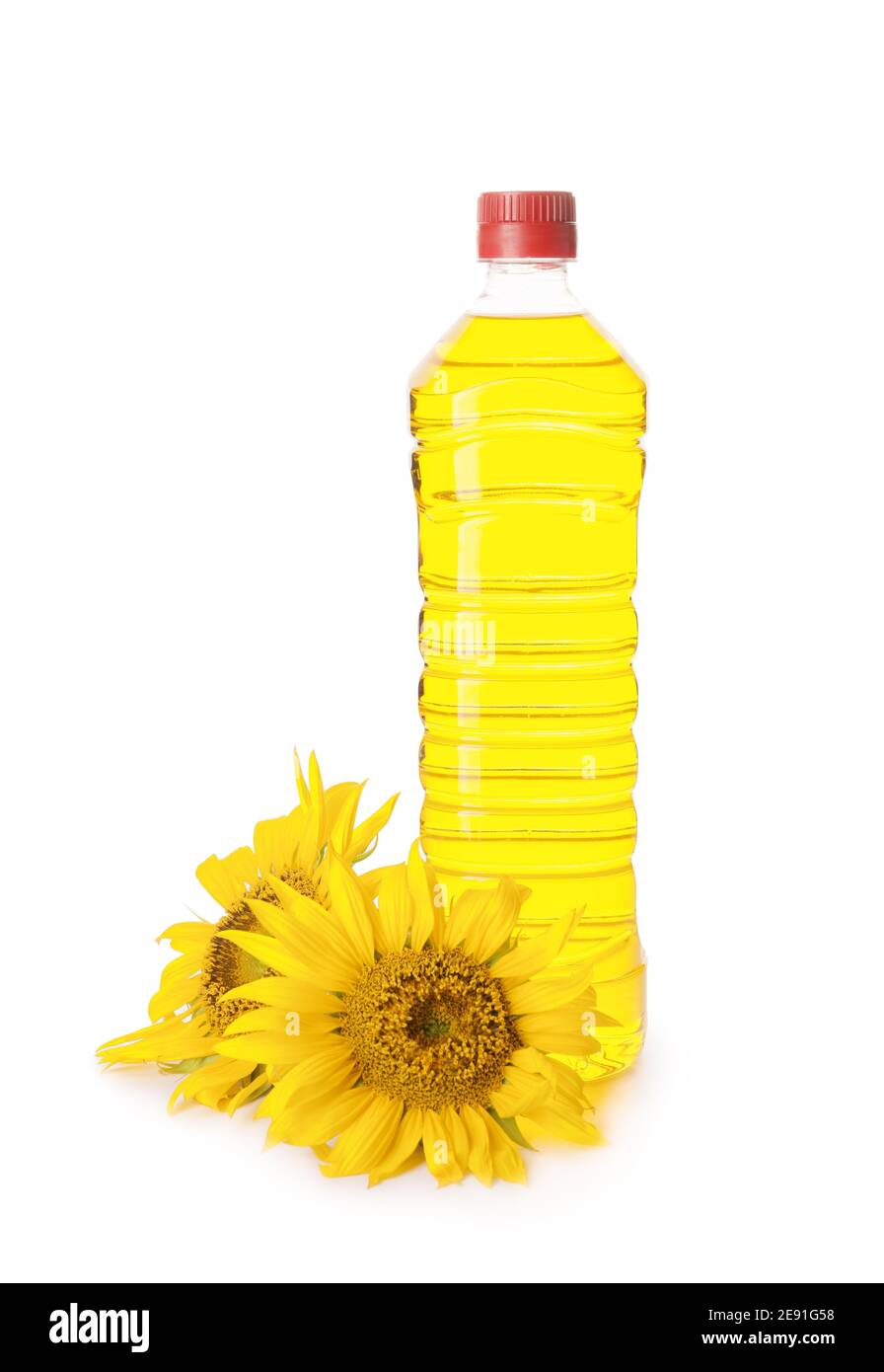 Bottle of oil and sunflowers on white background Stock Photo - Alamy