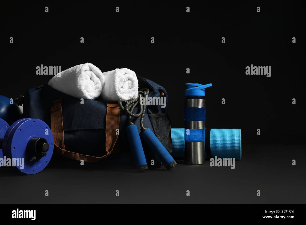 Set of sports equipment on dark background Stock Photo - Alamy