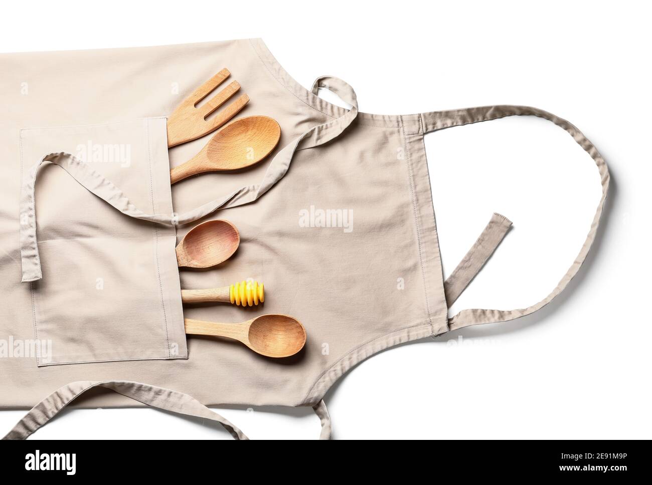 Apron and eco cutlery on white background Stock Photo - Alamy