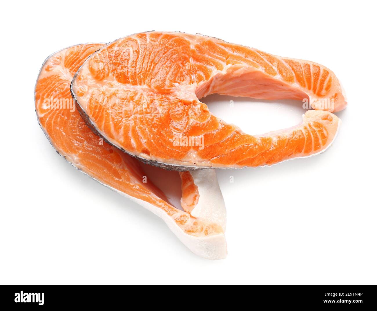 Raw salmon steaks on white background Stock Photo - Alamy