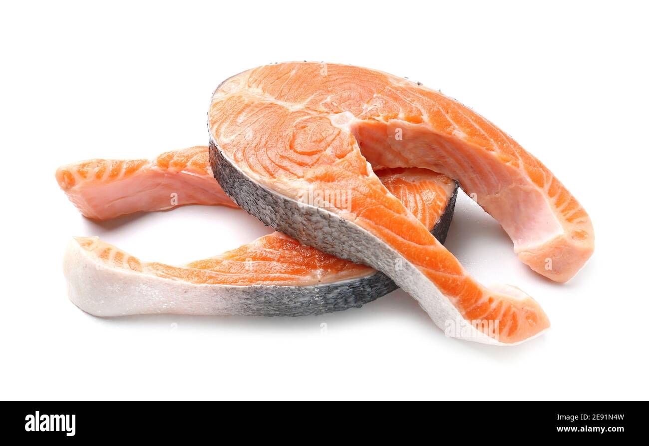 Raw salmon steaks on white background Stock Photo - Alamy