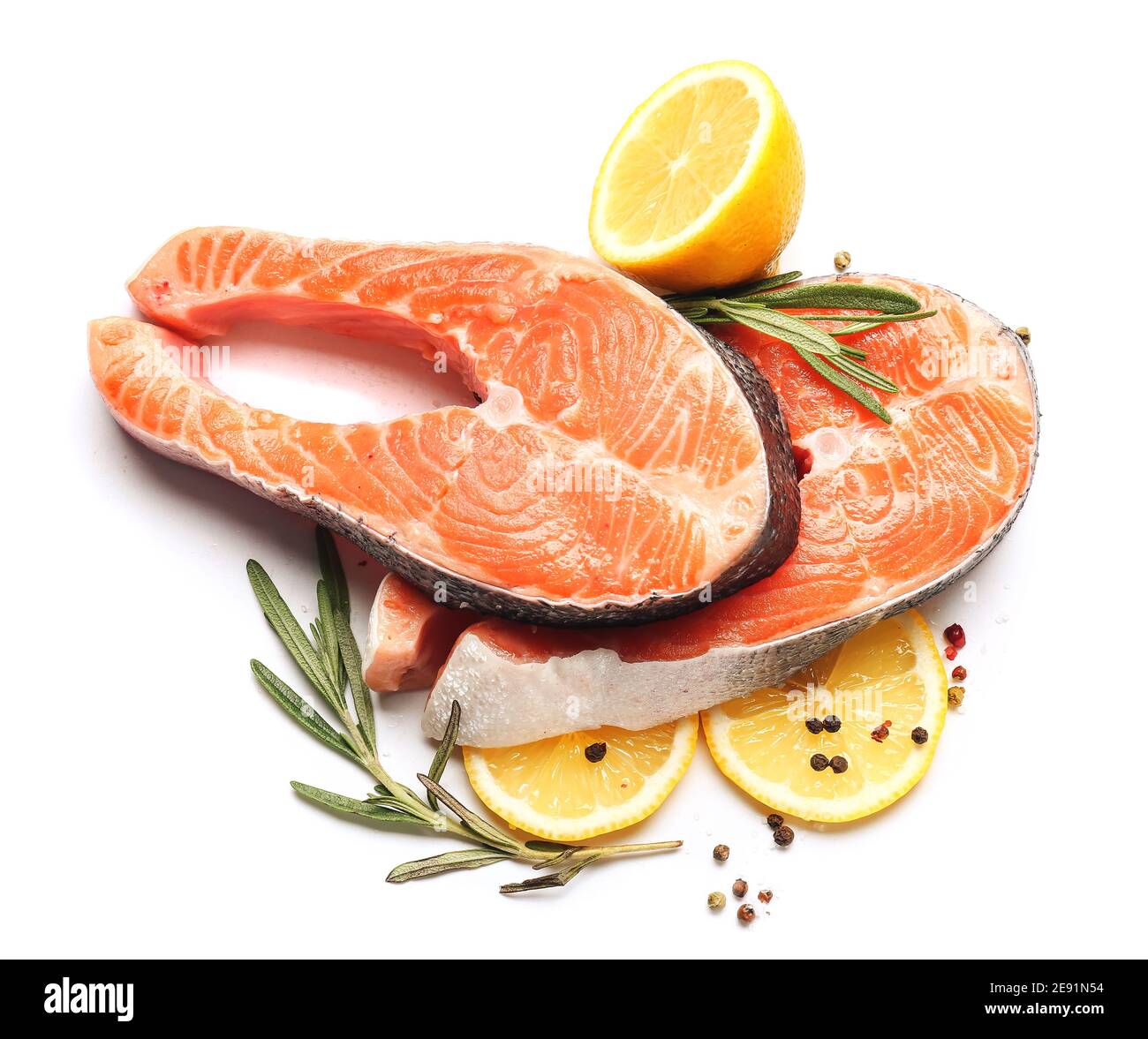 Raw salmon steaks and lemon on white background Stock Photo - Alamy