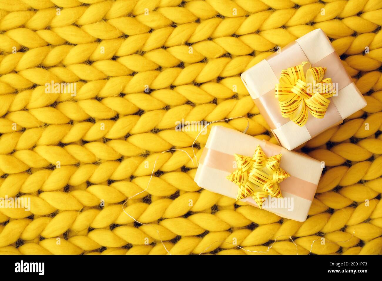 Gift boxes on knitted plaid, top view Stock Photo