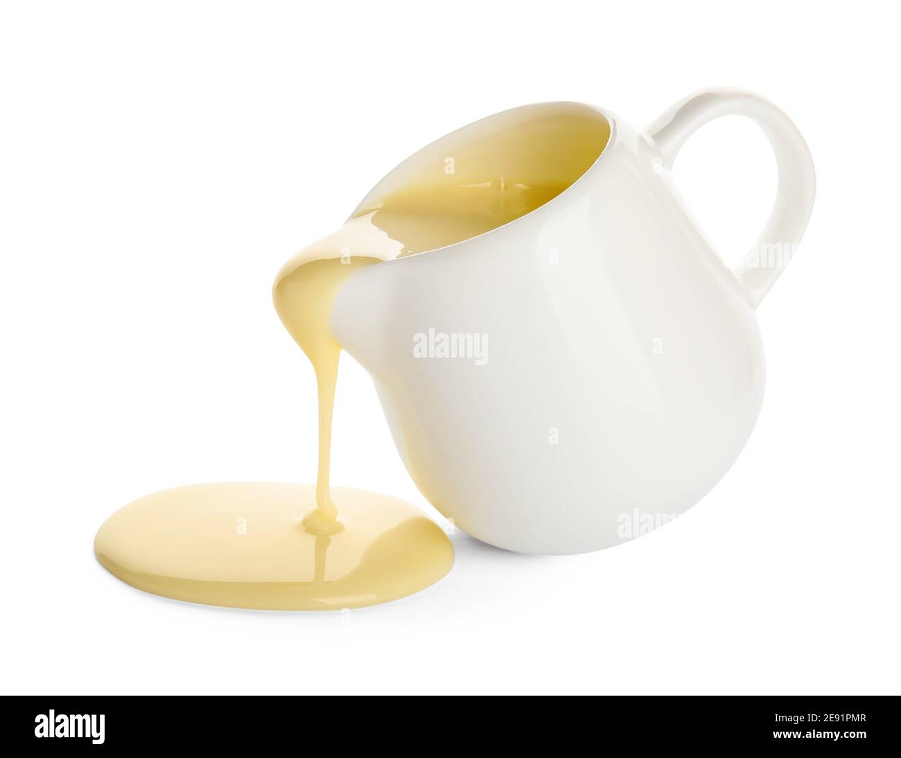 Jug with sweet condensed milk on white background Stock Photo