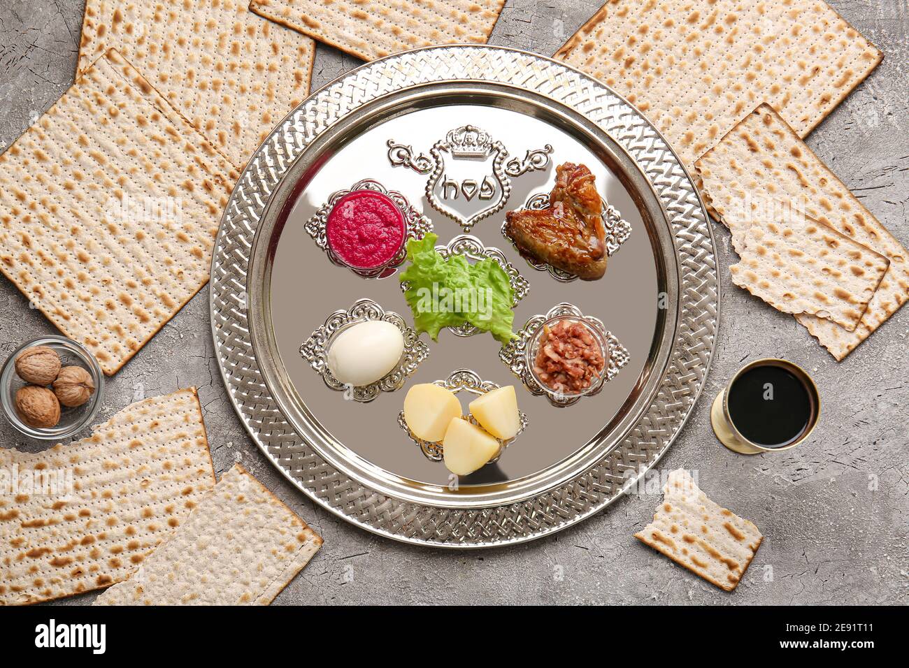 Passover Seder plate with traditional food on grunge background Stock ...