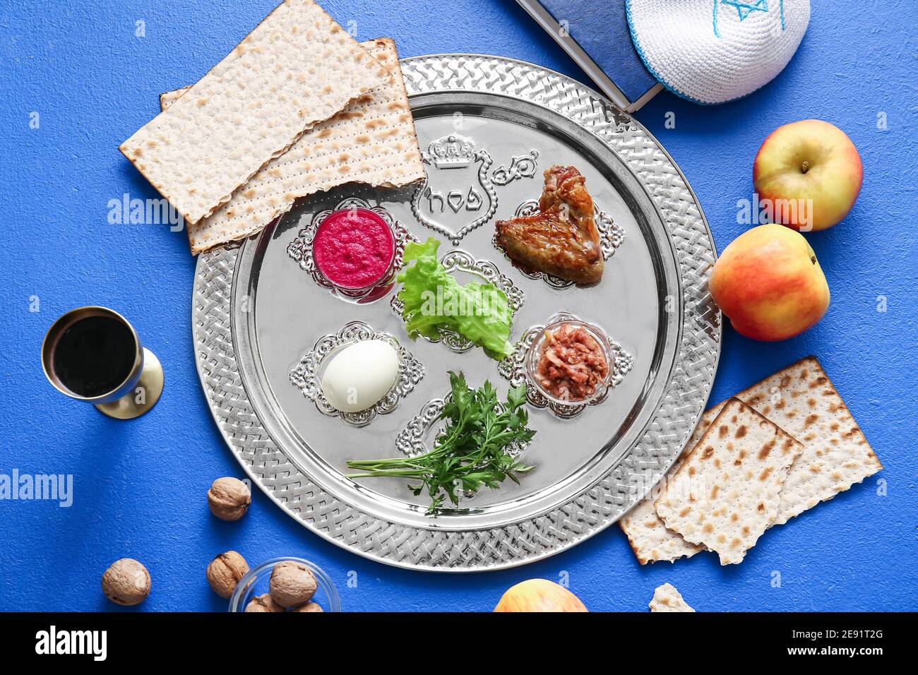 Passover Seder plate with traditional food on color background Stock ...