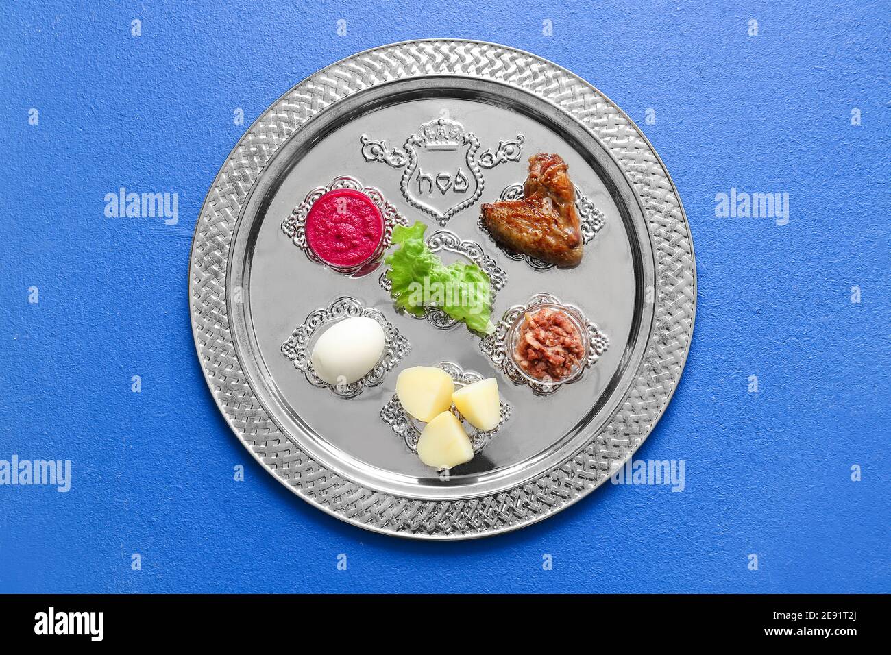 Passover Seder plate with traditional food on color background Stock ...