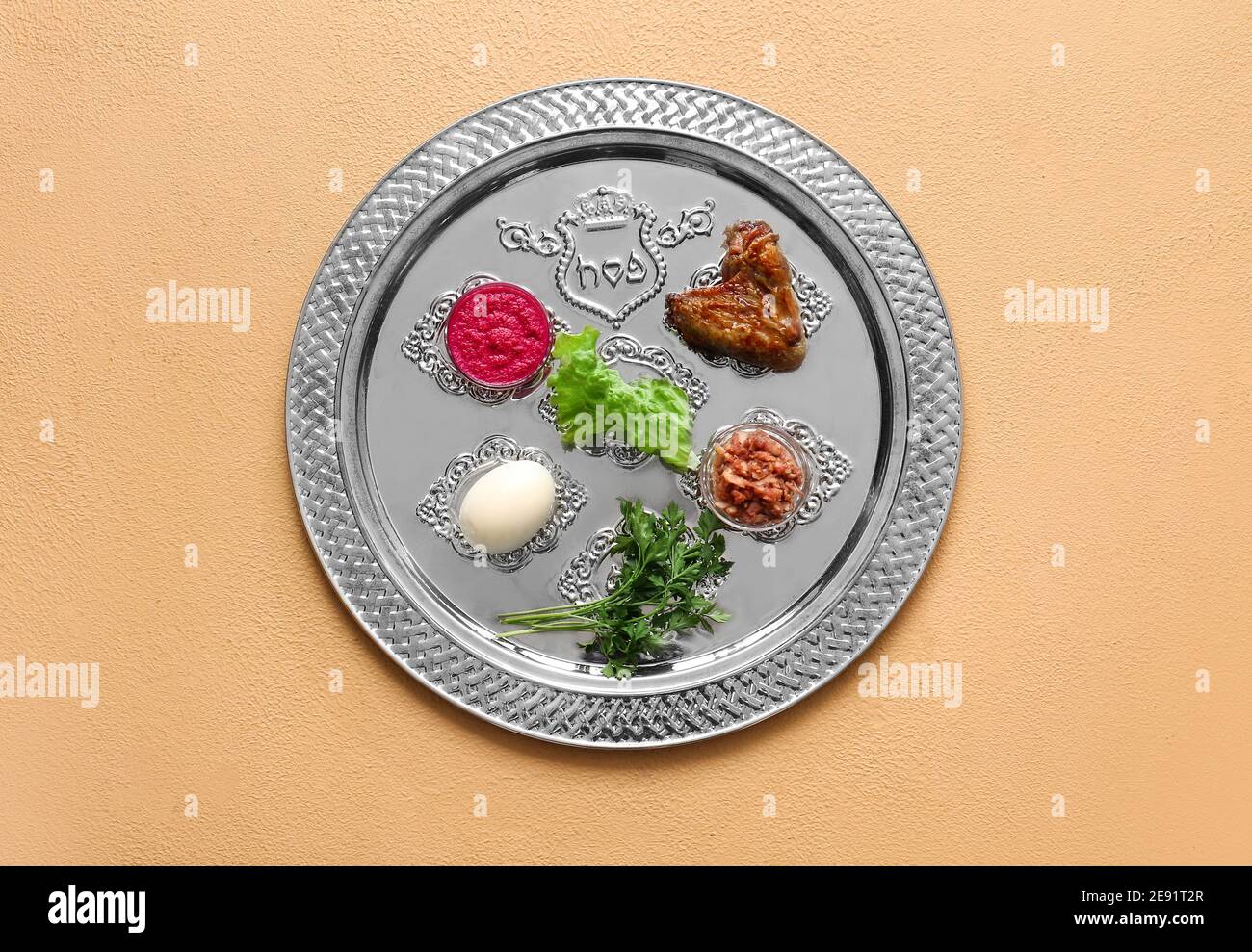 Passover Seder plate with traditional food on color background Stock ...