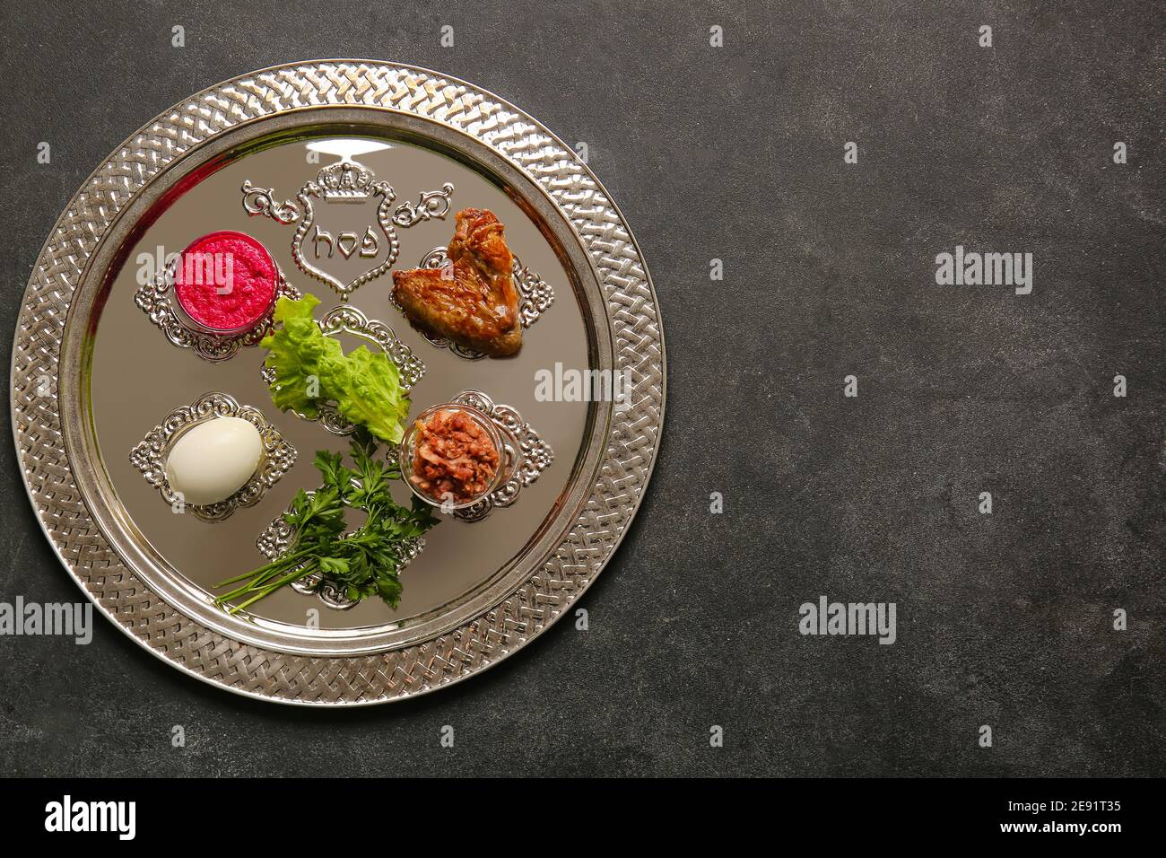 Passover Seder plate with traditional food on dark background Stock ...