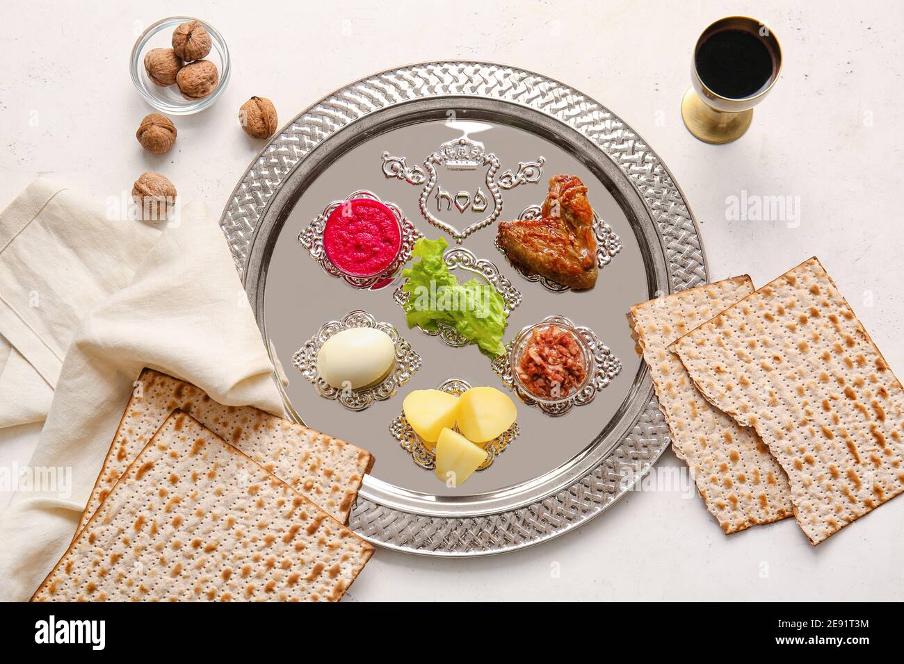 Passover Seder plate with traditional food on white background Stock ...