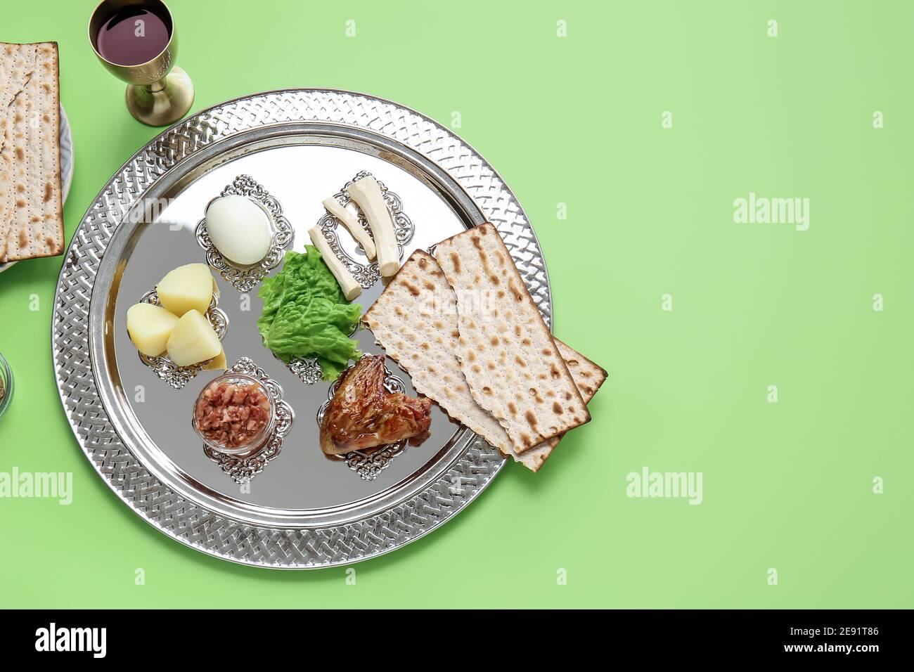 Passover Seder plate with traditional food on color background Stock ...