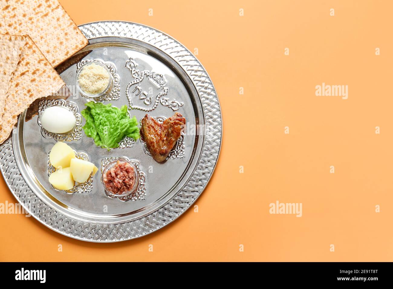 Passover Seder plate with traditional food on color background Stock ...