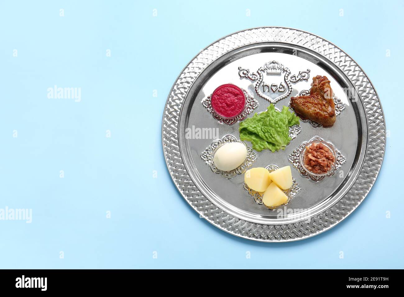 Passover Seder plate with traditional food on color background Stock ...