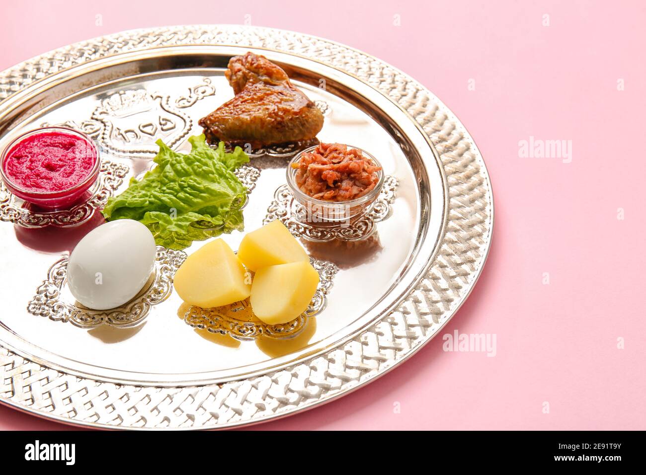 Passover Seder plate with traditional food on color background Stock ...
