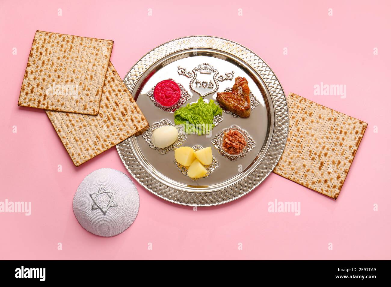 Passover Seder plate with traditional food and Jewish cap on color background Stock Photo Alamy