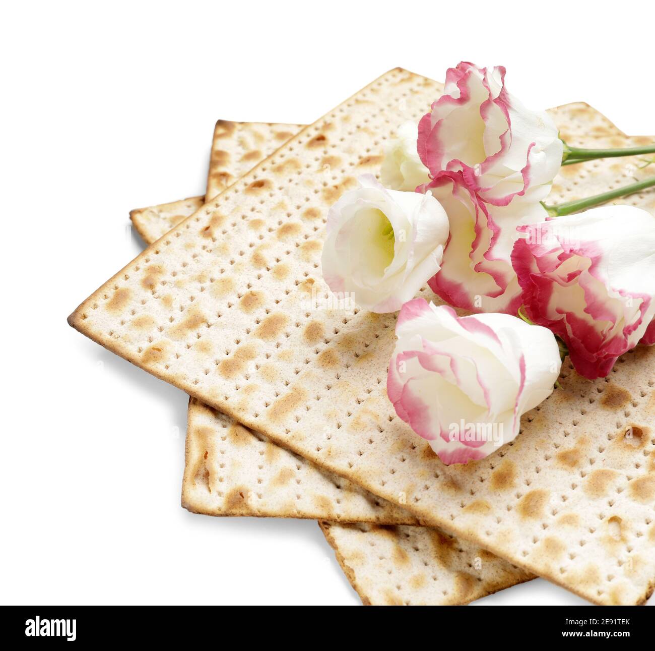 Jewish flatbread matza for Passover and flowers on white background Stock Photo Alamy