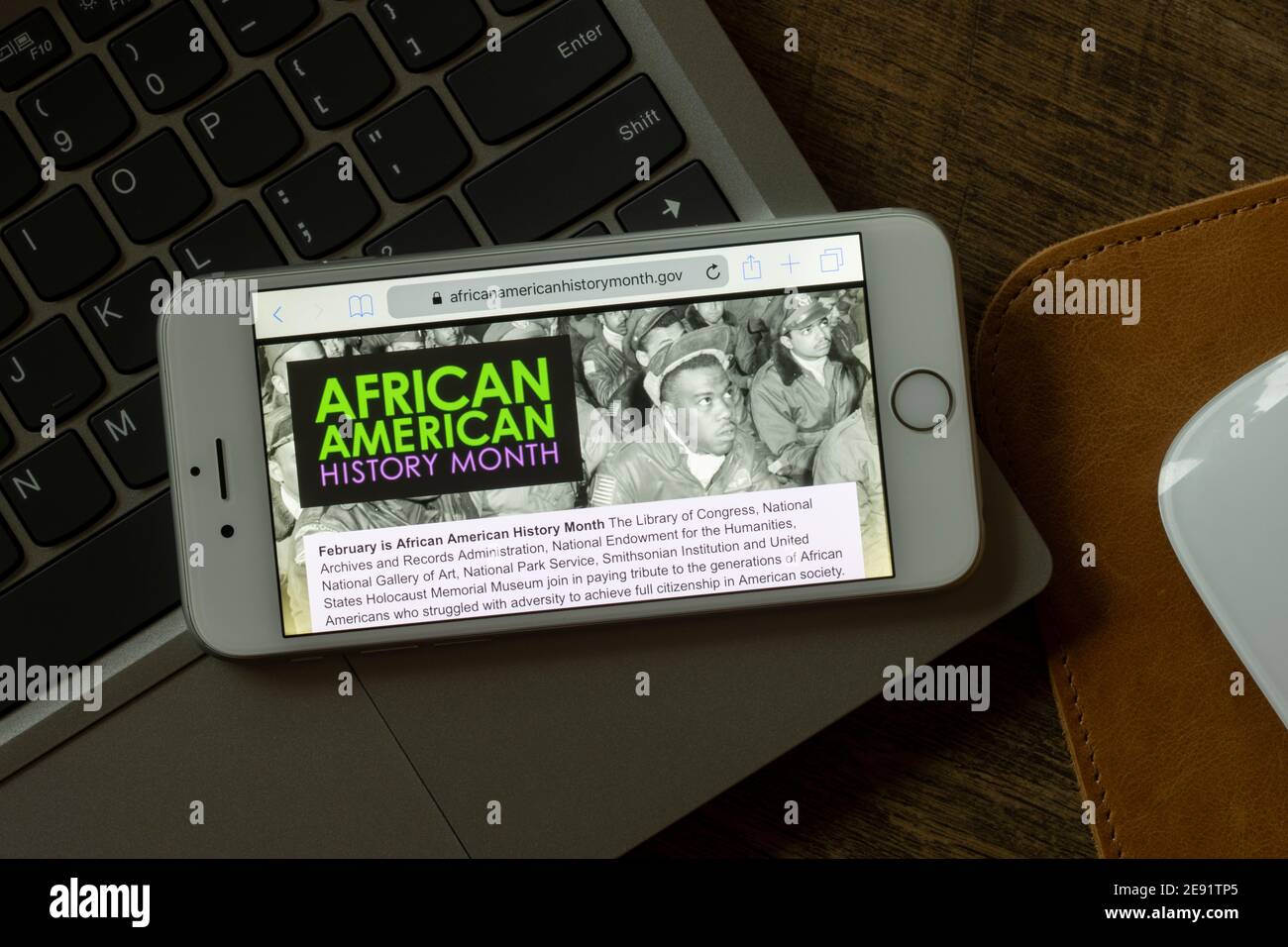 The homepage of the official website of the African American History Month is seen on a smartphone on Feb 1, 2021. Stock Photo