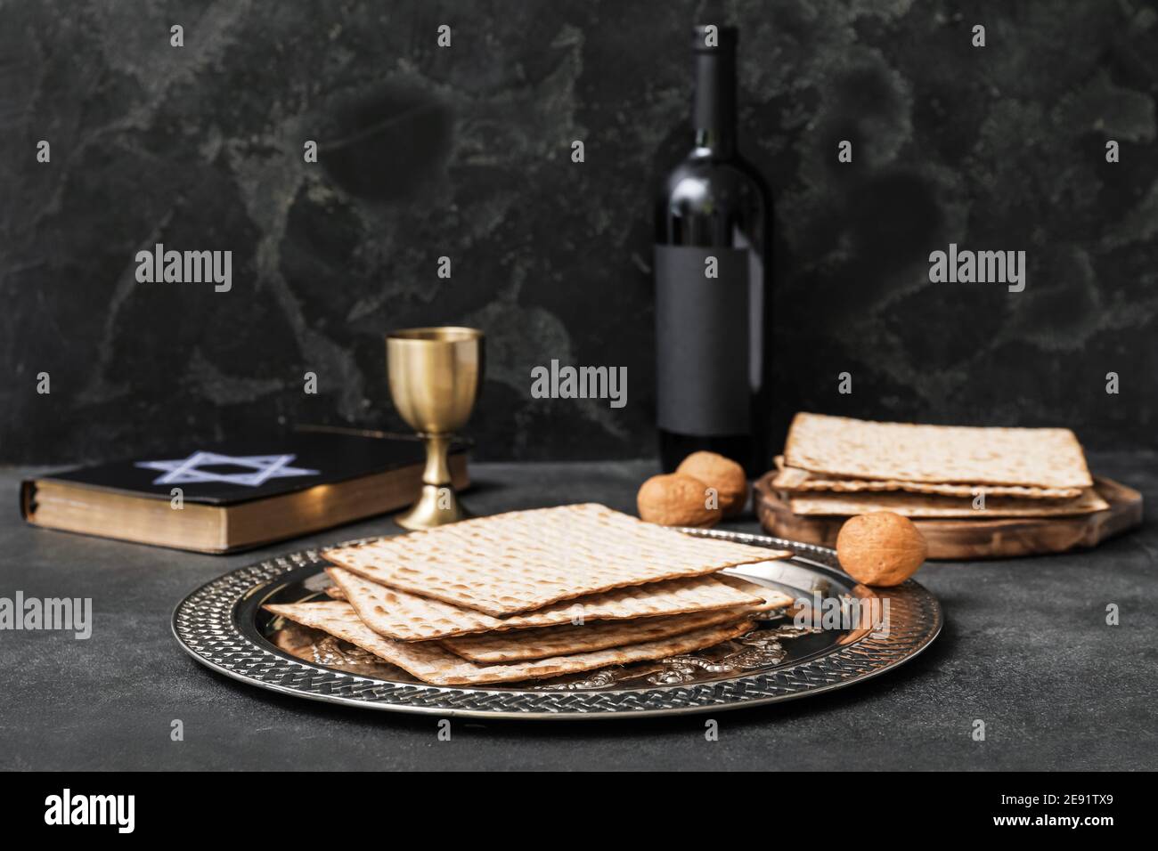 Passover Seder plate with matzo on dark background Stock Photo - Alamy