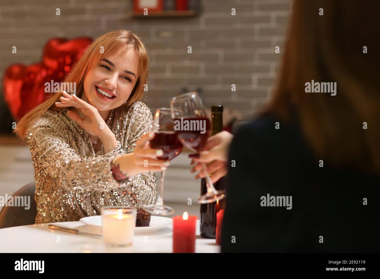 Happy transgender couple celebrating Valentine's Day at home Stock ...
