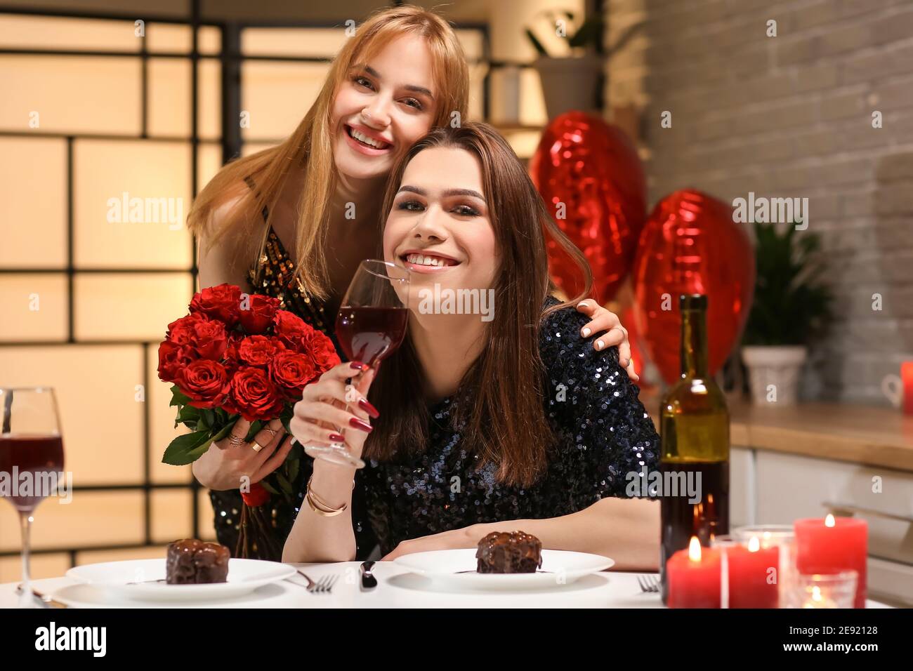 Happy transgender couple celebrating Valentine's Day at home Stock ...