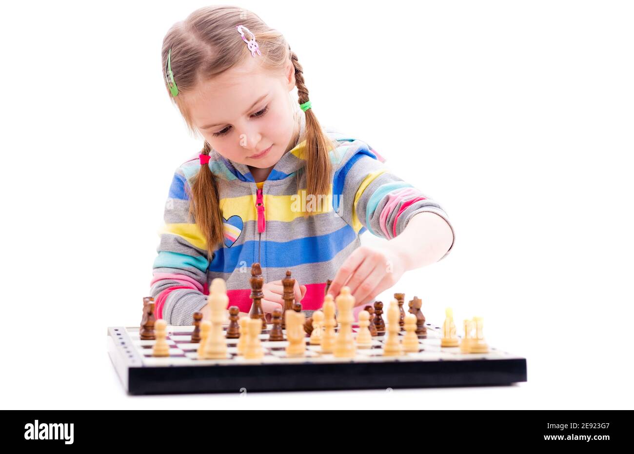 Premium Photo  Portrait of child during chess game boy plays chess and  thinks intently about the next move isolation on white background