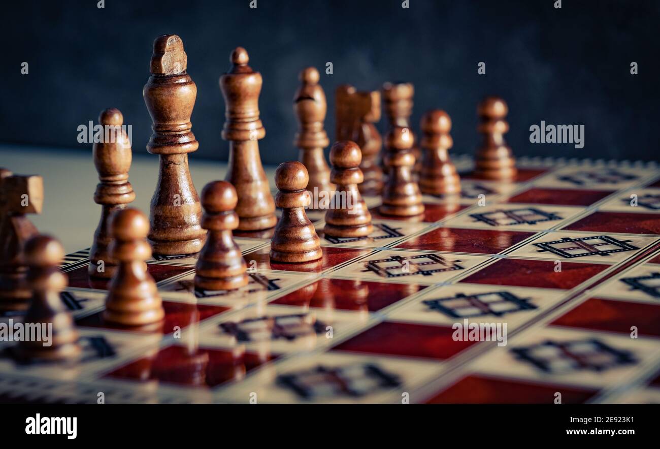 Closeup wooden figures on chess game board Stock Photo
