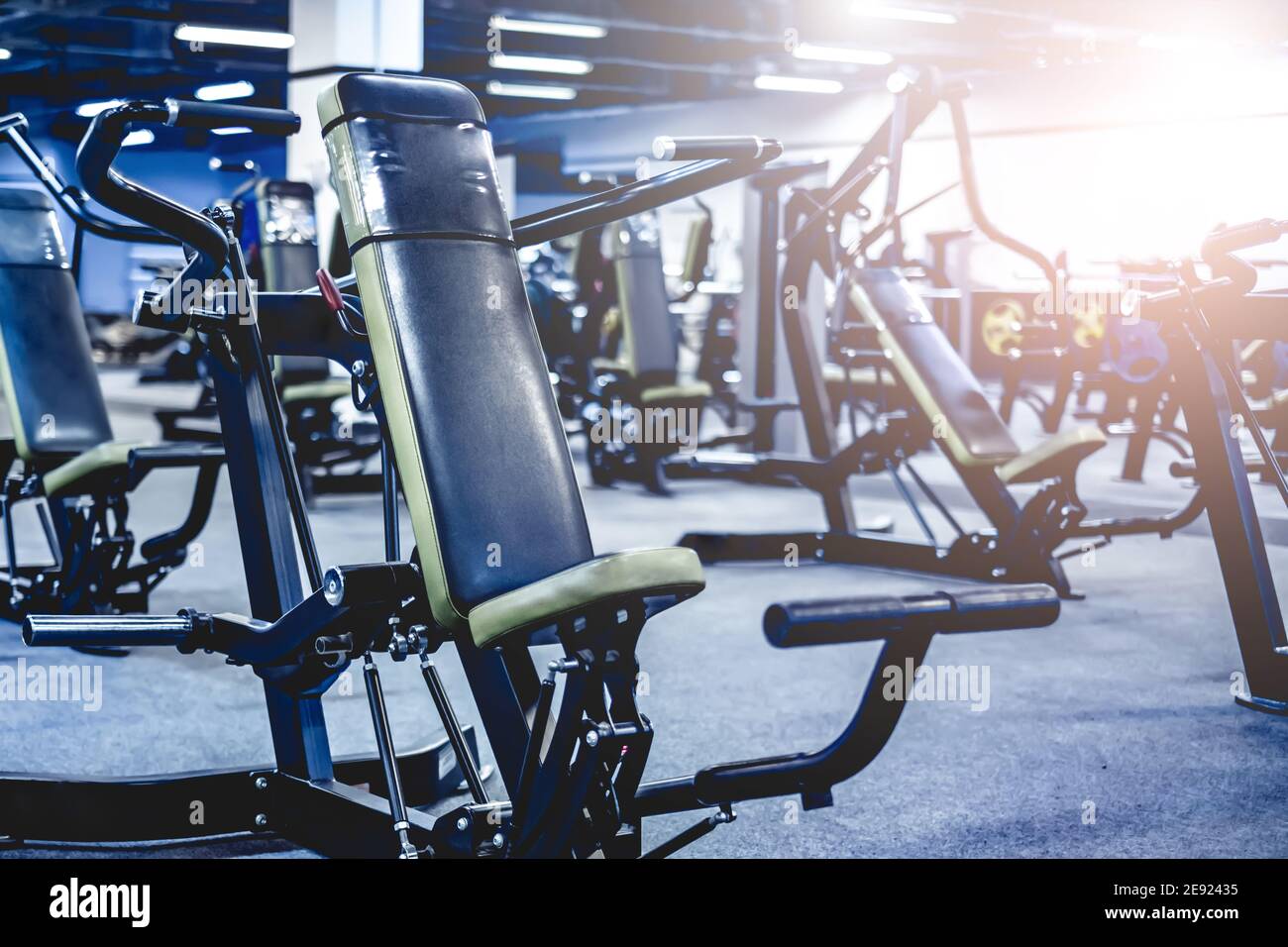 Fitness and bodybuilder machine for shoulders in modern gym Stock Photo