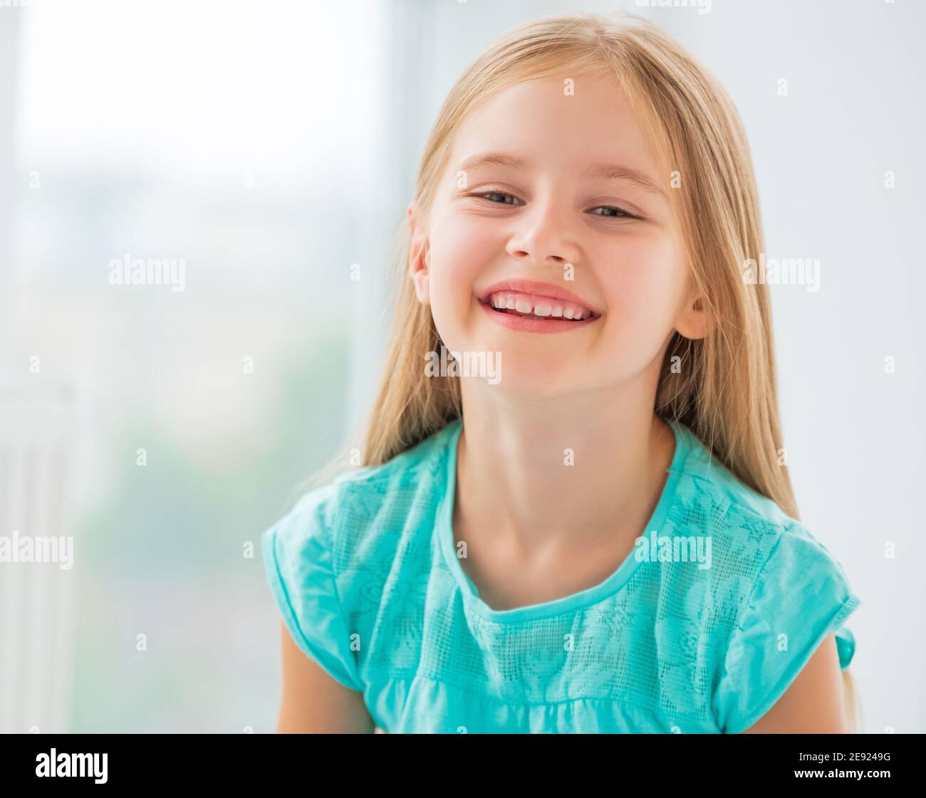Portrait of smiling beautiful school girl Stock Photo - Alamy