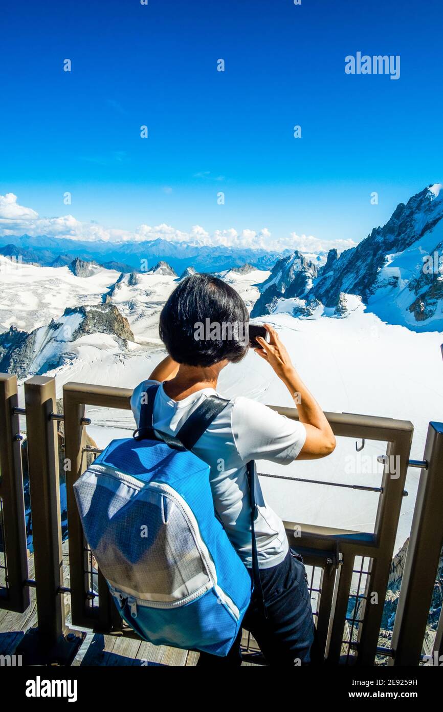 Woman mountain top binocular hi-res stock photography and images - Alamy