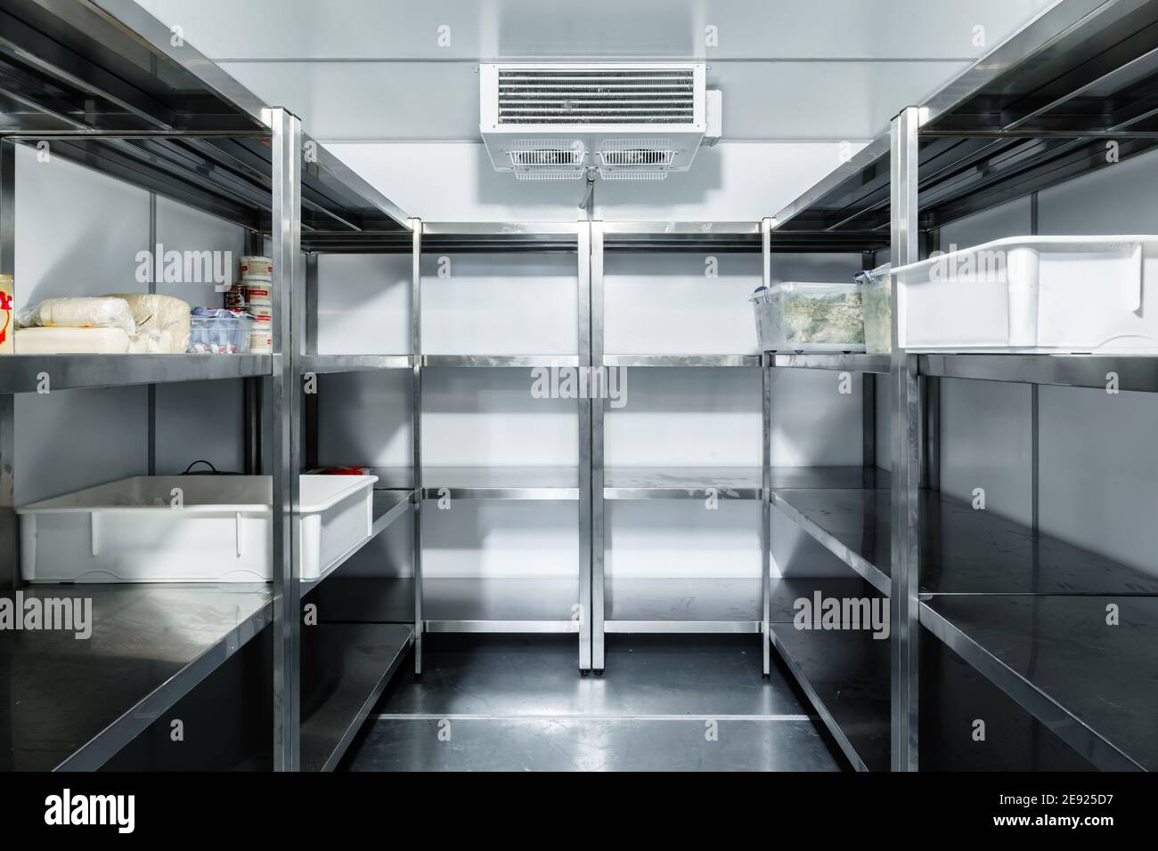 Refrigerator chamber with steel shelves in a restaurant Stock Photo