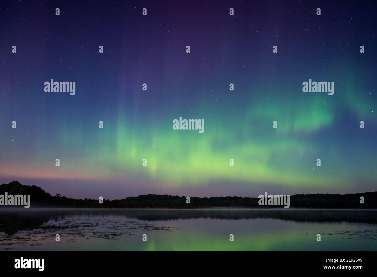 The northern lights, aurora borealis over a lake in Wisconsin Stock ...
