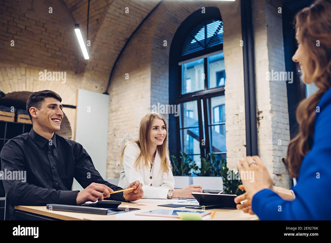 businesspeople discussing at table in office Stock Photo