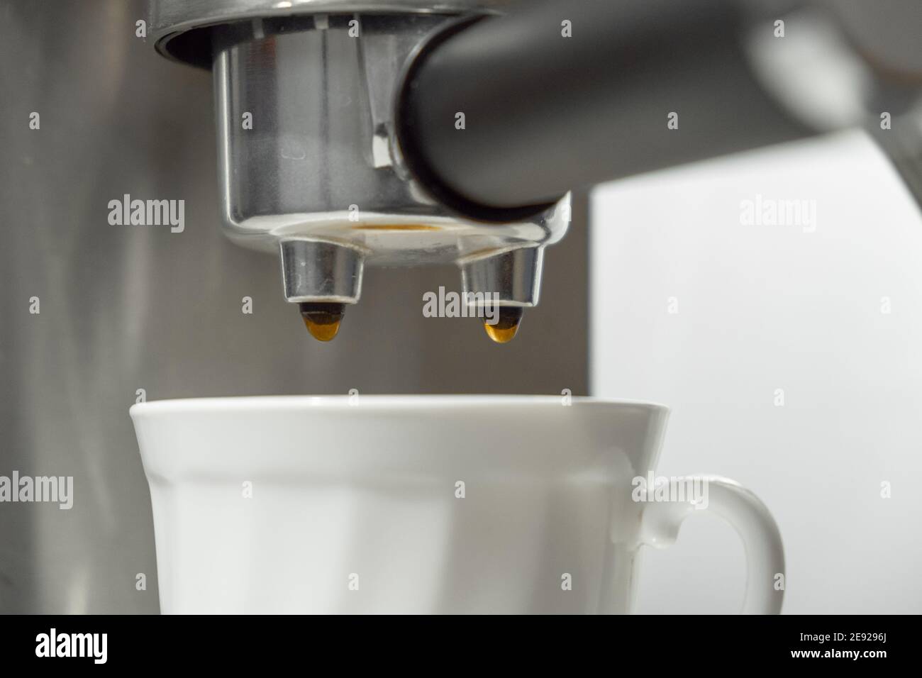 Coffee machine portafilter closeup during the process of pouring