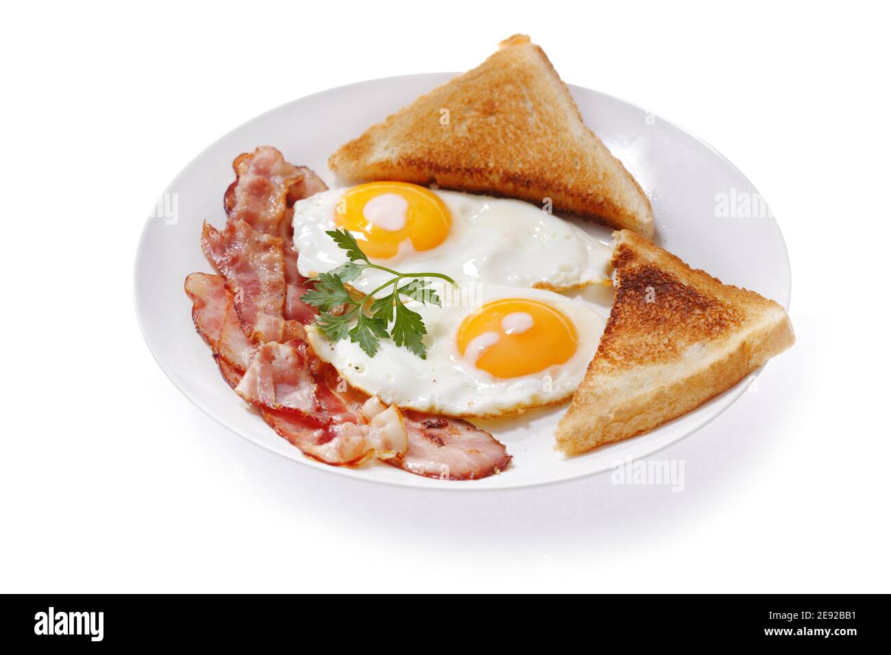 plate of fried eggs, bacon and toast isolated on white background Stock ...