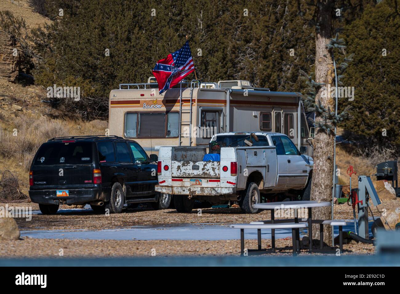 Mt Carmel, Utah, United States- 01312021: a camper put a blended Gadsden USA Confederate Flag, Triple Threat Flag on his RV near Zion National Park. ' Stock Photo